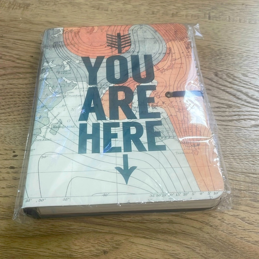 Travel journal with pen and keepsake envelope built in.  📕🌎